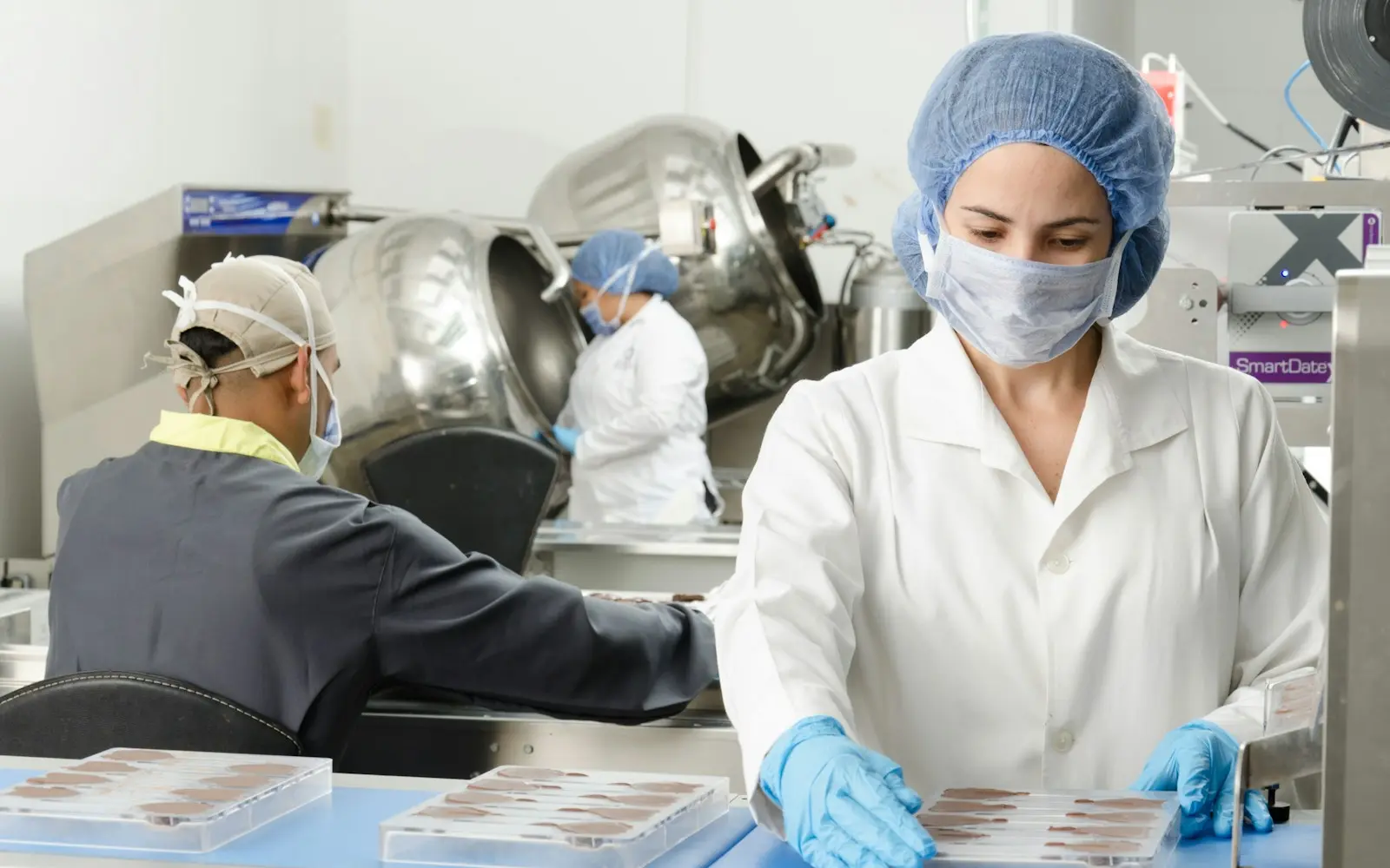 Staff packing product on a pharmaceutical packaging line